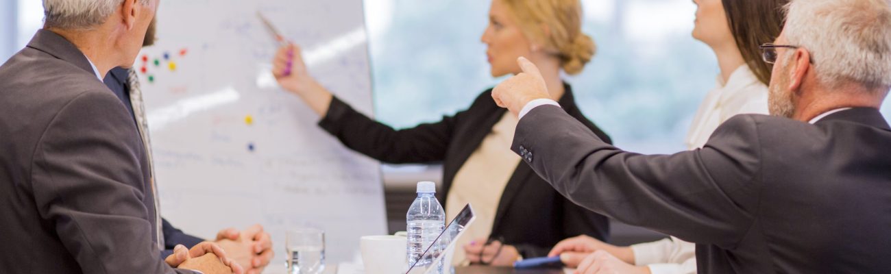 businessman-presenting-new-project-partners-office